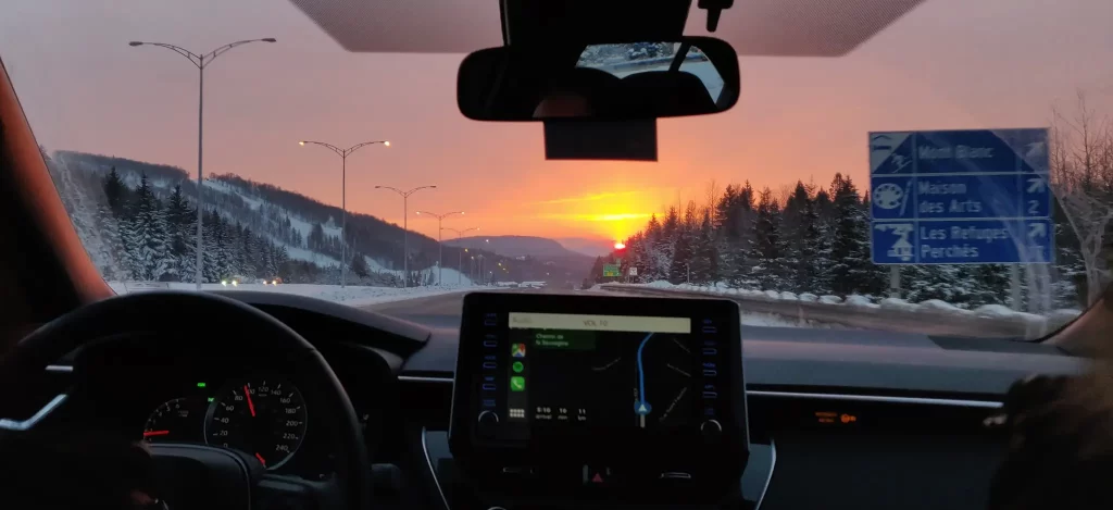 Sunset view on the laurentides in a car