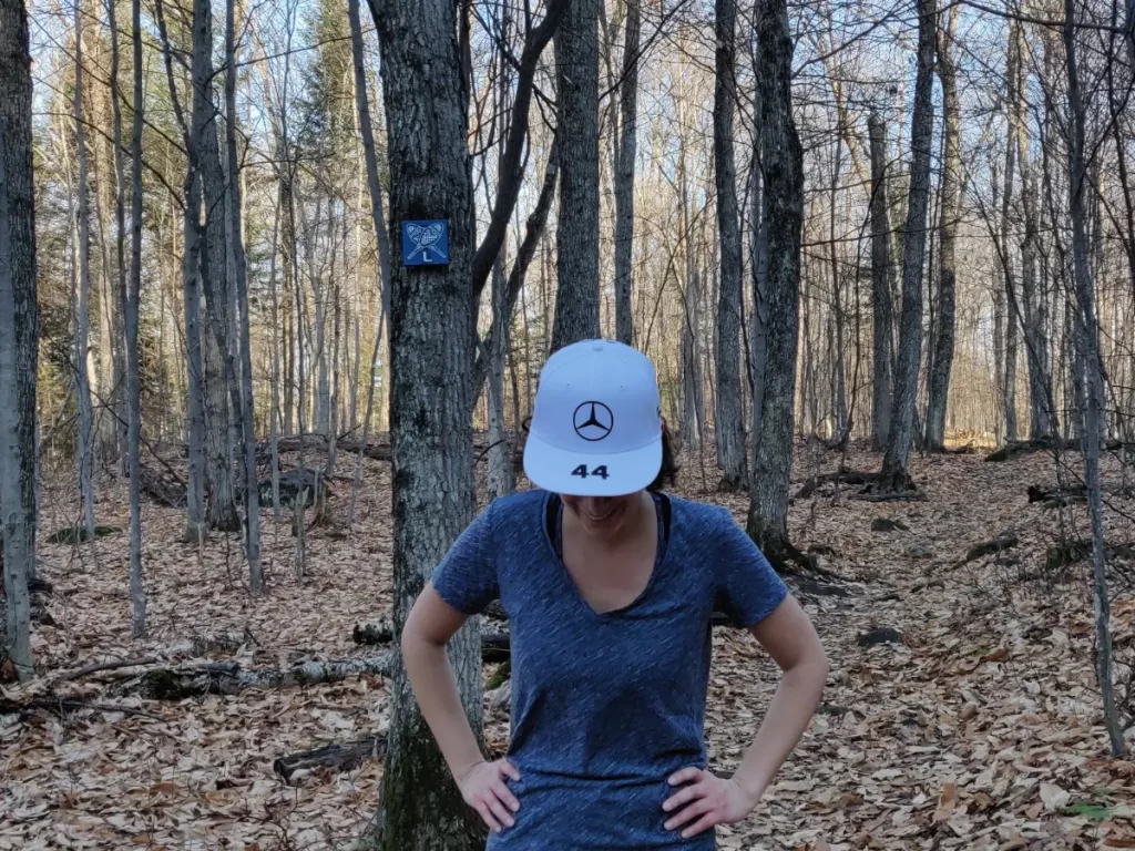 Girls with head lowered standing in a forest in the fall