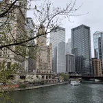 a view of chicago buildings over the river