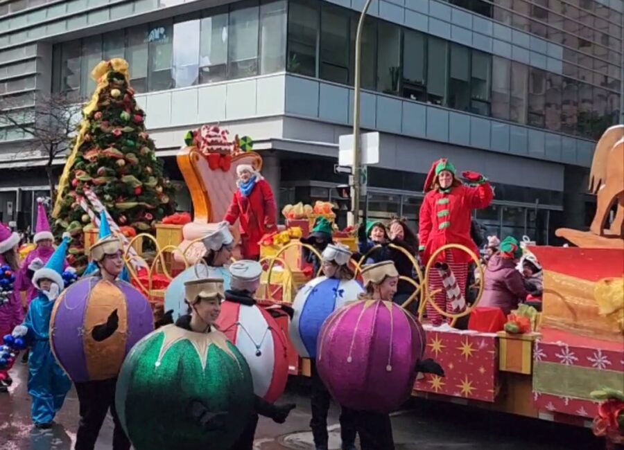 Santa Claus Parade floats and ornament costumes on a downtown Montreal street