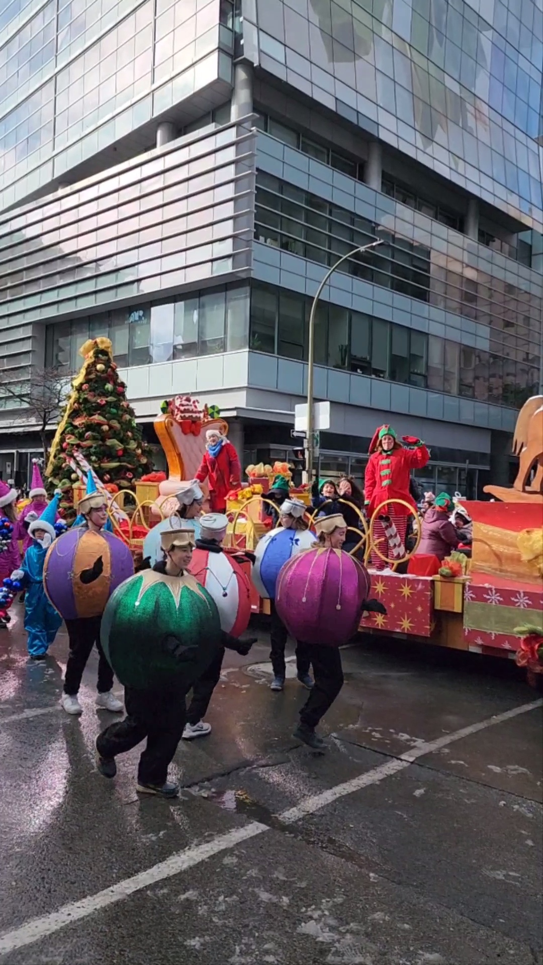 Santa Claus Parade floats and ornament costumes on a downtown Montreal street